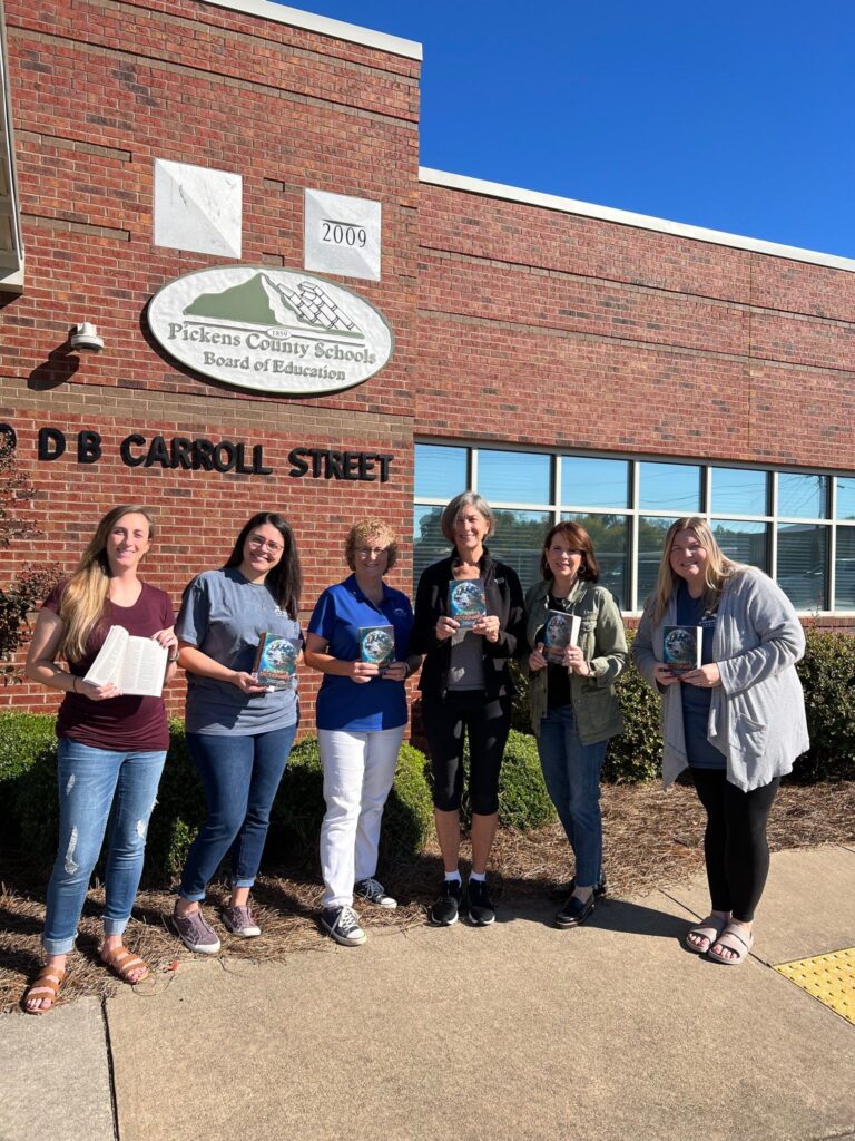 Rotary Volunteers With Dictionaries For Students